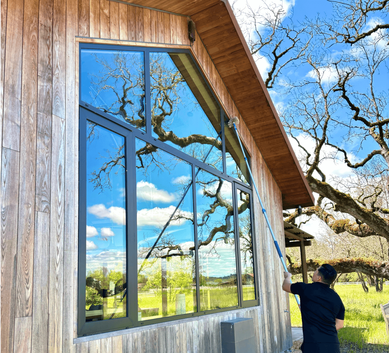 website for cleaning company - person cleaning window